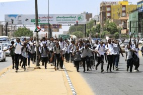 Sudan army commander says security force at a bank killed protesting children
